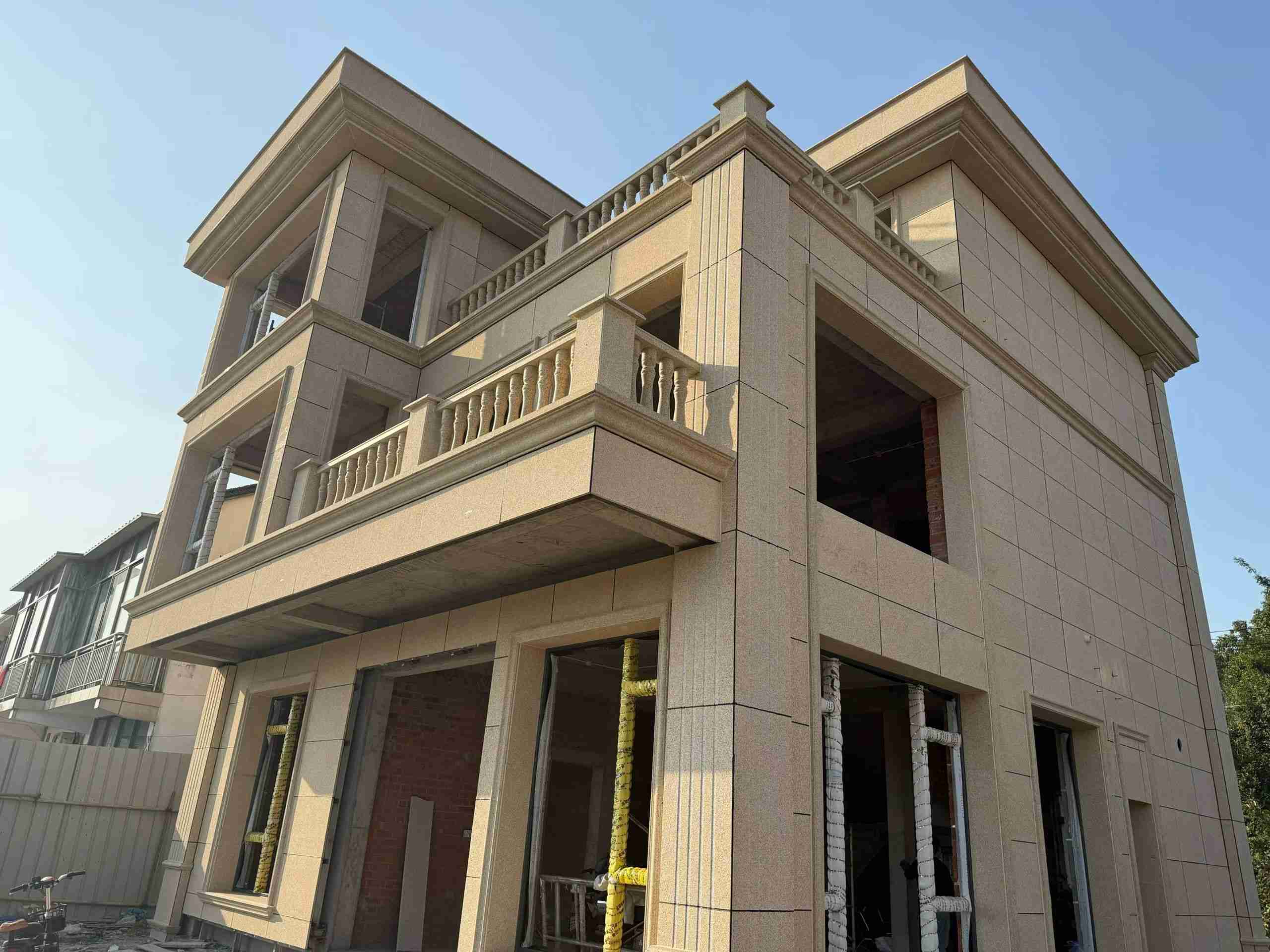 梅州 黄金麻花岗岩石材荔枝面外墙干挂效果展示